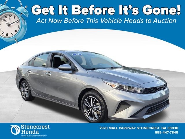 2024 Kia Forte LXS in Steel Gray — front three-quarter view