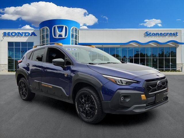 2024 Subaru Crosstrek Wilderness in Sapphire Blue Pearl — front three-quarter view