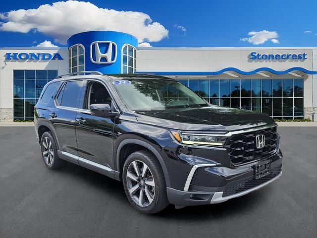 2024 Honda Pilot Touring in Crystal Black Pearl — front three-quarter view