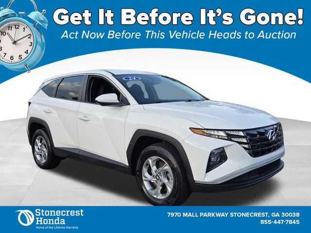 2024 Hyundai Tucson SE in White Pearl — front three-quarter view