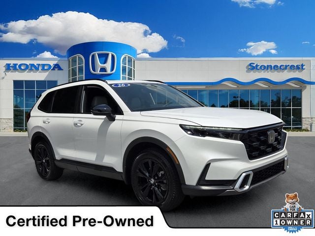 2026 Honda CR-V Hybrid Sport Touring in Platinum White Pearl — front three-quarter view